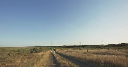 Children Running Over the Camera in Field