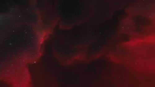 Un vaisseau spatial vole près d'une nébuleuse rouge dans l'espace