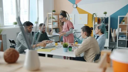Slow Motion of Smartphone Application Developers Talking Discussing Project in Office
