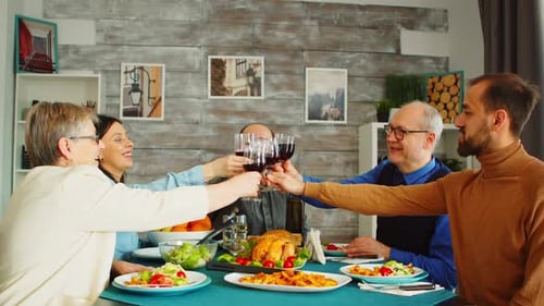 Family and Friends Having Dinner and Wine Together