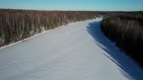 Nature of Russia Flyover of River and Pine Trees Covered with Snow