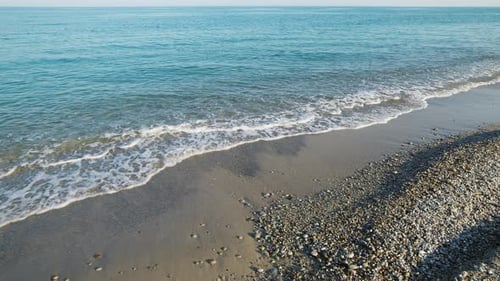 Beach with Sea and Calm Waves in Summer in Sicily