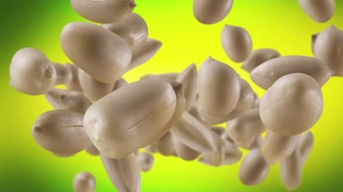 Flying of Roasted Peanuts in Lime Green Background