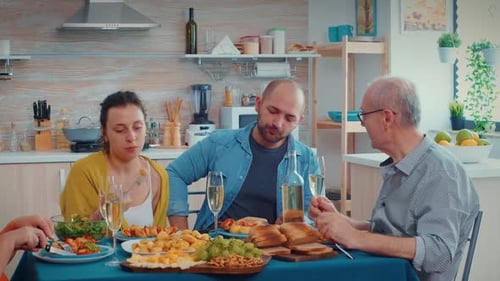 Family enjoys appetizers at the dinner table