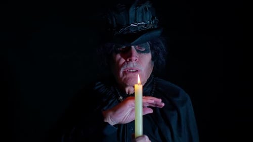 Wizard Casting Spells With Candle in the Dark
