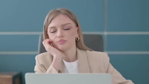 Close Up of Businesswoman Sleeping While Sitting in Office