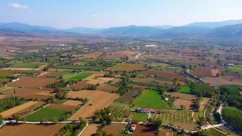 Scenic Aerial View of Mountain Valley with Agricultural Fields