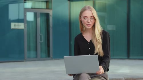 Young Woman Talking on Video Call with Laptop