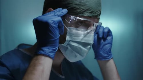 Surgeon Wearing Mask and Protective Eyewear