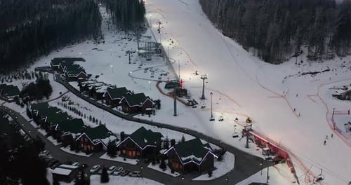 Aerial View: Ski Resort, Slope and Chair Lift. Cableway Lifts Skiers To the Mountain Hill. Winter