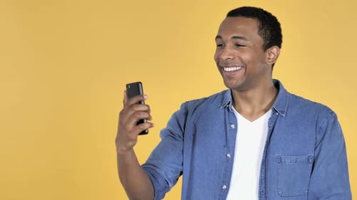 Young Adult Taking a Selfie and Smiling