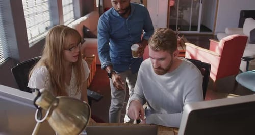 Young creative professionals working in a modern office