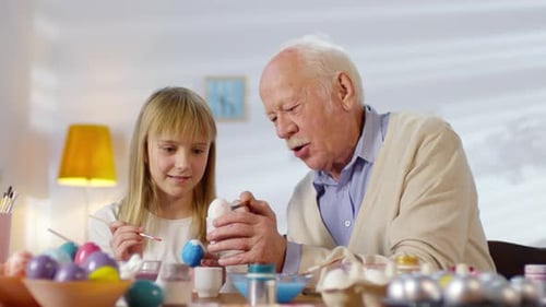 Sequence of Girl and Grandfather Preparing for Easter