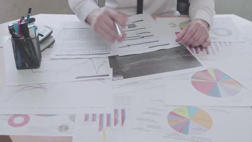 Businessman works with charts and documents