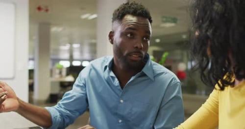 Man and Woman Working Together in Office Setting