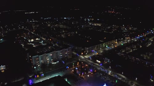 Aerial view of city buildings at night. Aerial night shot of city lights from above