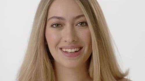 Smiling Woman with Long Blonde Hair Talking Close Up