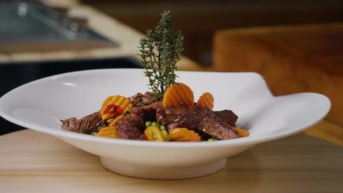 Gourmet Dish with Meat and Carrots Spinning