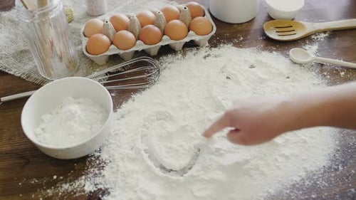 Baking Heart with Flour, Eggs and Utensils