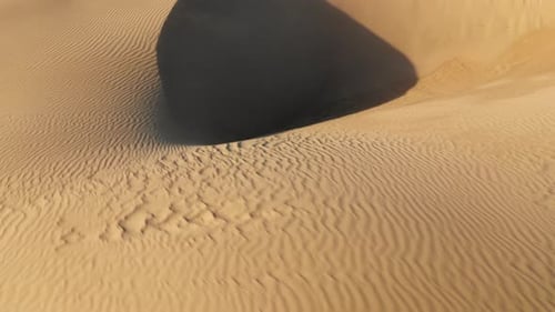 Aerial Drone Flying Low Above Incredible Wavy Texture of the Sand Desert