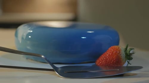 Glossy Blue Cake with Fresh Strawberry Close Up