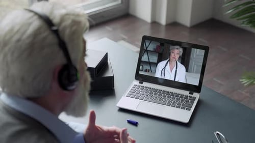 Senior Man Having Virtual Appointment with Doctor