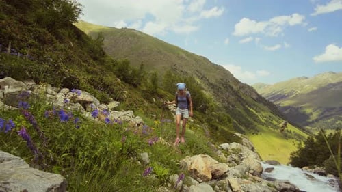 Woman Backpacker Hiking in Mountain