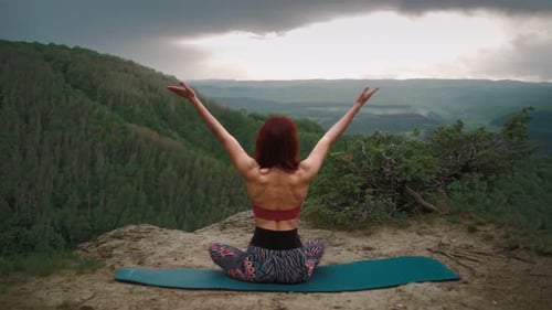 Girl Practices Yoga While Sitting in Lotus Position Beautiful Mountain Landscape