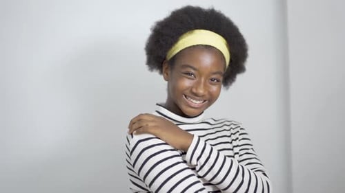 Smiling attractive Portrait lovely of African american teen school girl and looking at camera