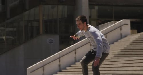 Caucasian man practicing parkour