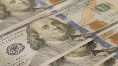 Lot of hundred dollar banknotes close-up 4K 2160p 30fps UltraHD tilting footage - USA paper curre
