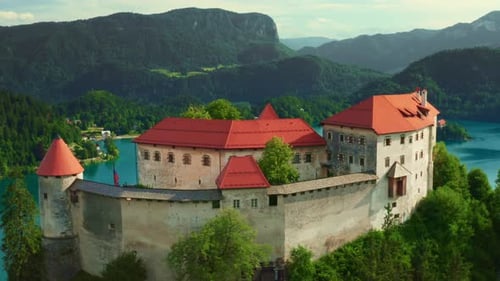 Ancient Castle Overlooking Bled Lake and Forestry Mountains