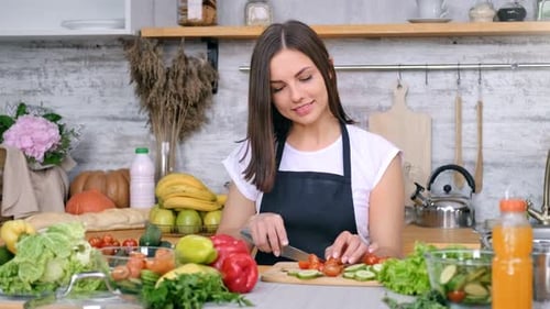Woman Preparing Fresh Vegetables in Kitchen