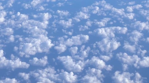 Flying Over the White Clouds. The View From the Airplane Window.