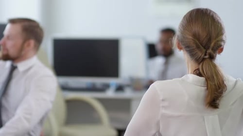 Office Workers Do Seated Torso Twists for Wellness