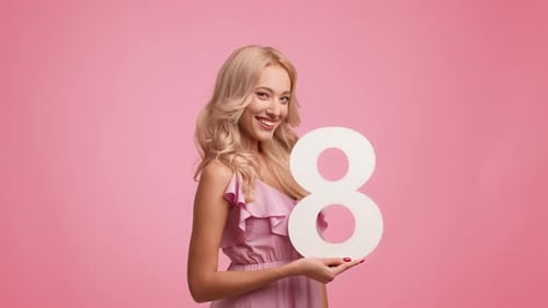 Blonde Woman Smiling with Number Eight on Pink