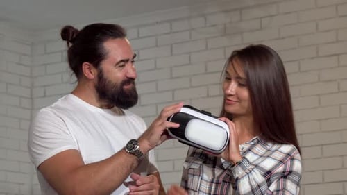 Woman Tries on Virtual Reality Headset with Friend