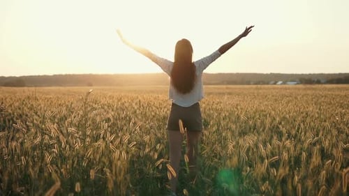 Cute Girl Standing Alone in Field.