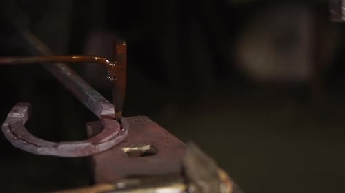 Metal Horseshoe Being Crafted in Workshop