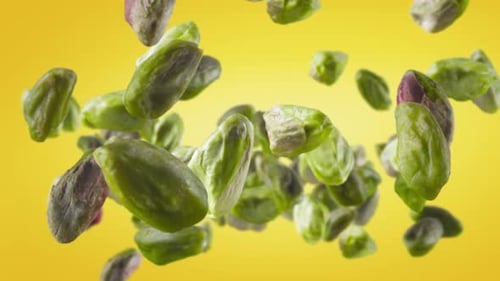 Shelled Pistachios Falling in Slow Motion
