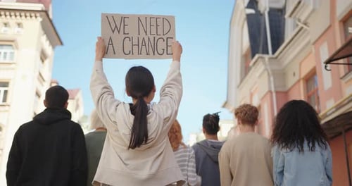 Group Protesting for Change on Urban Street