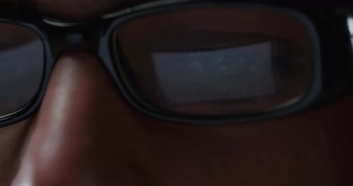 Face with Glasses, Reflection of Screen Close Up