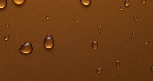 Abstract water drops on gold bronze background, macro, Bubbles close up
