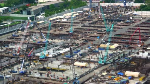 Large Construction Site with Heavy Construction Machinery in Metropolis