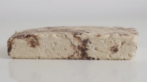 Block of sesame halva with cocoa flavor 4K footage