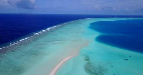 Natural overhead clean view of a white sand paradise beach and blue ocean background in hi res 4K