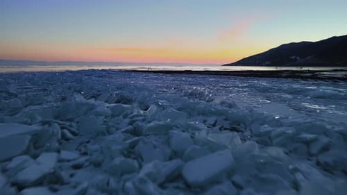 Flying over a lake covered in hummocks. Ice debris piled on top of each other