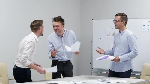 Happy Office Workers Are Excited in Workplace Having Fun Throwing Papers Documents Enjoying Success