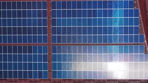 Solar panels from above. Aerial drone view of solar panels on the roof of building