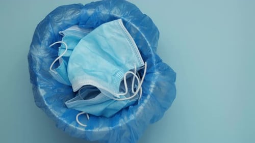 Overhead View of Used Face Masks in Trash Can
